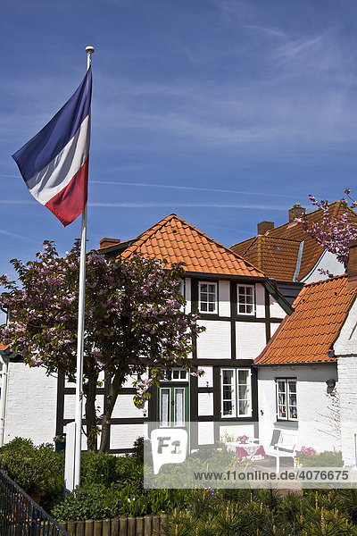 Historic timber-framed houses in Arnis on the Schlei River  flag of Schleswig-Holstein  Bad Arnis  Schleswig-Holstein  Germany  Europe