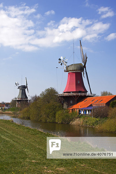 Twin mills in Greetsiel  windmill  built in the style of a two-storey Dutch gallery windmill with a wind rose  Krummhoern Greetsiel  Eastern Frisia  Lower Saxony  Germany  Europe