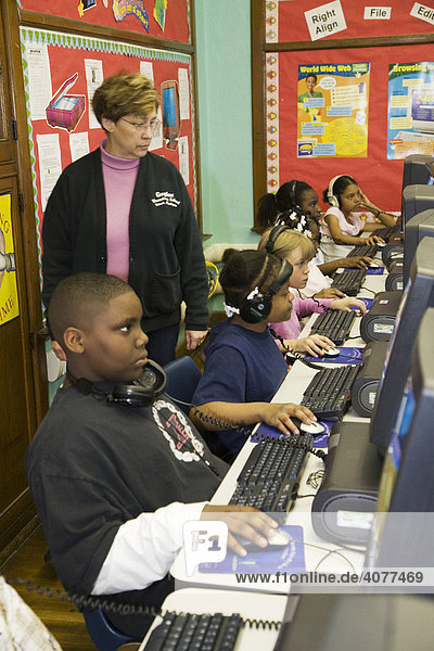 Fourth grade students in the computer lab at Guyton Elementary School Detroit Michigan USA