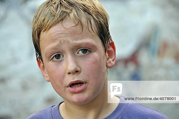 Sweaty 8-year-old boy  football yard in Cologne  North Rhine-Westphalia  Germany  Europe