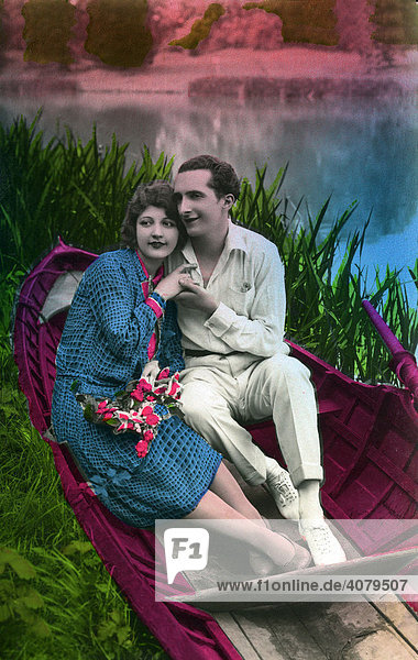 Courting couple in a boat  historical photo  circa 1930