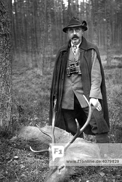 Historic photo  hunter with killed deer  ca. 1920