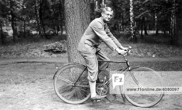 Historic photograph  man on a bicycle  around 1925