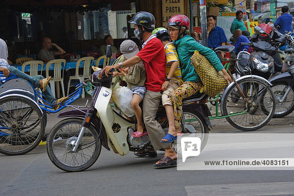 Four people sharing a bike  Ho Chi Minh City (Saigon)  Vietnam  Asia