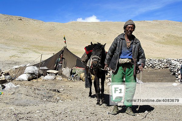 Tibetan Nomads man with horse in front of the tent Everest region Tibet China