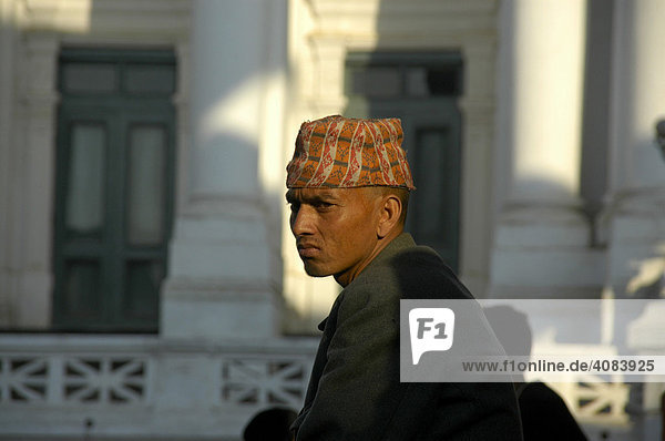 Portrait of a Newar man with traditional hat at Hanuman Dhoka Old Royal Palace Kathmandu Nepal