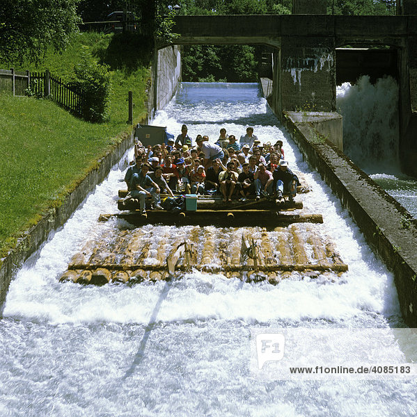 Mühlthal Muehlthal near Strasslach south of Munich Upper Bavaria Germany float slide with float passengers