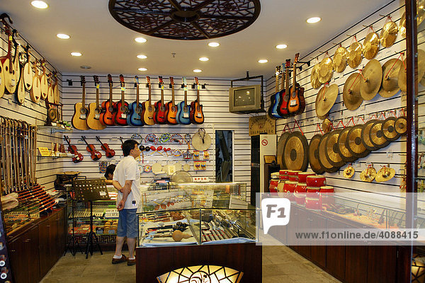 Shop for musical instruments in the new built quarter at the Yu-garden in the evening  Shanghai  China  Asia