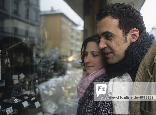 Couple in front of a shop window