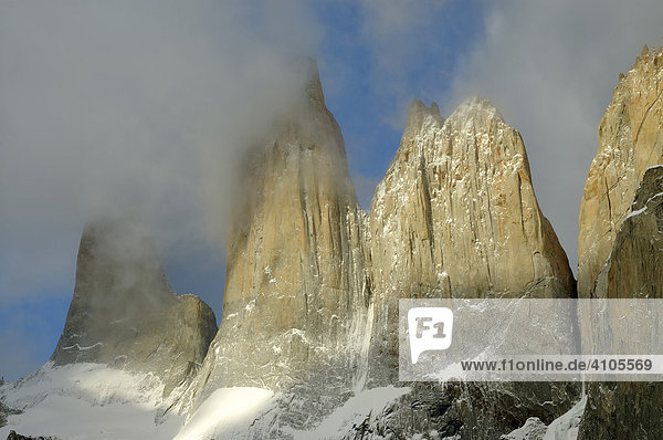 Three rock towers in the clouds  Torres del Paine National Park  Patagonia  Chile (Torres del Peine)
