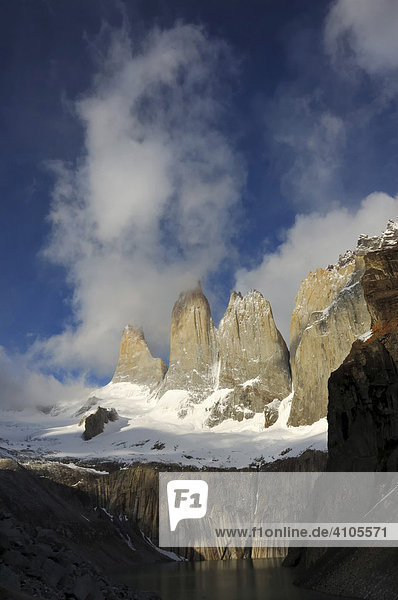 Three rock towers in the clouds  Torres del Paine National Park  Patagonia  Chile (Torres del Peine)