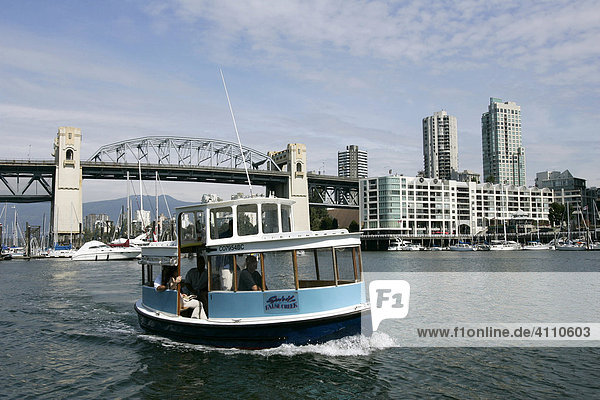 False creek ferry in front of Burrard Street bridge betweeen Vancouver and Granville Island  Vancouver  British Columbia  Canada