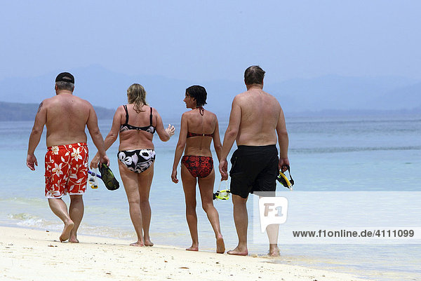 Tourists walking on the sandy beach of the island Koh Kradan - Andaman Sea   Thailand  Asia