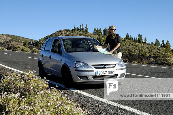 Woman with car  Teide National Park  Tenerife  Canary Islands  Spain