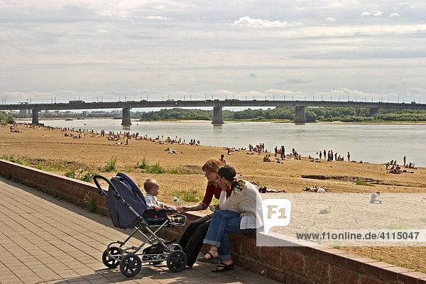 Two young Women with baby and baby carriage at the River Promenade  Omsk at the Rivers of Irtisch and Omka  Omsk  Sibiria  Russia  GUS  Europe