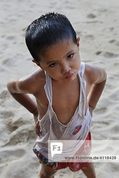 Sceptically looking boy at the beach  island Kho Samui  Thailand