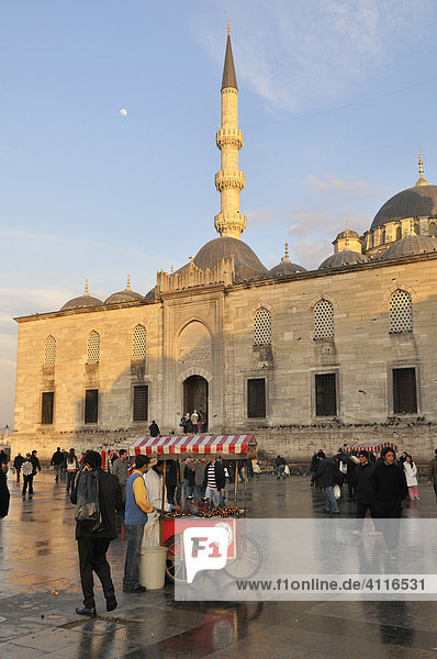 Roast chestnut street vendors in front of the Yeralti Camii Mosque  Istanbul  Turkey