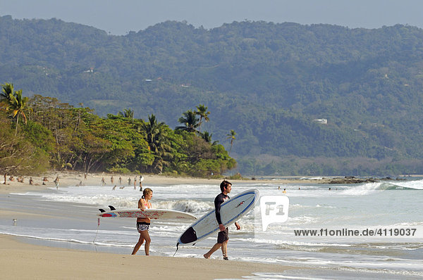 Surfer at the beach of Santa Teresa  Mal Pais  Nicoya Peninsula  Costa Rica  Central America