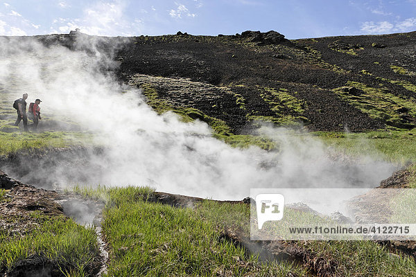 Hikers visiting hot springs  Hengill geothermal area  Hveragerði  Iceland  Atlantic Ocean