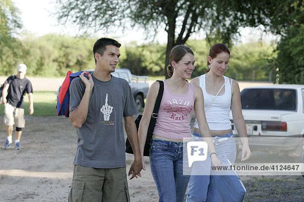 Teens walking hand in hand  Lomo Plata  Chaco  Paraguay