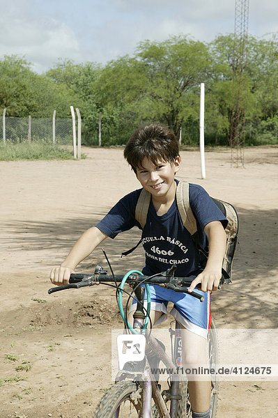 Cycling boy  Loma Plata  Chaco  Paraguay