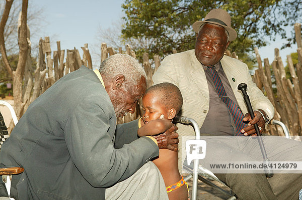 Healer treating a sick child  Sehitwa  Botswana  Africa