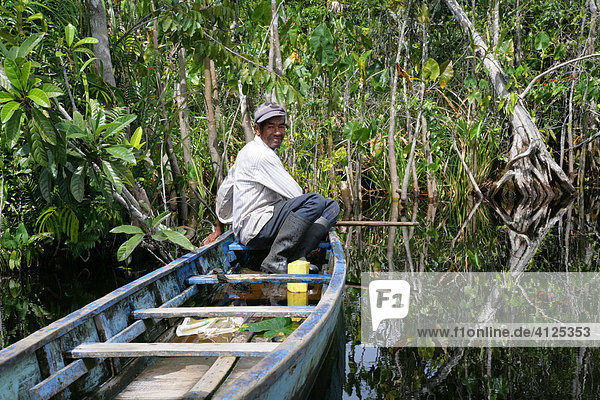 Fisherman  riverside landscape  Kamuni river in the Guayana rainforest  South America