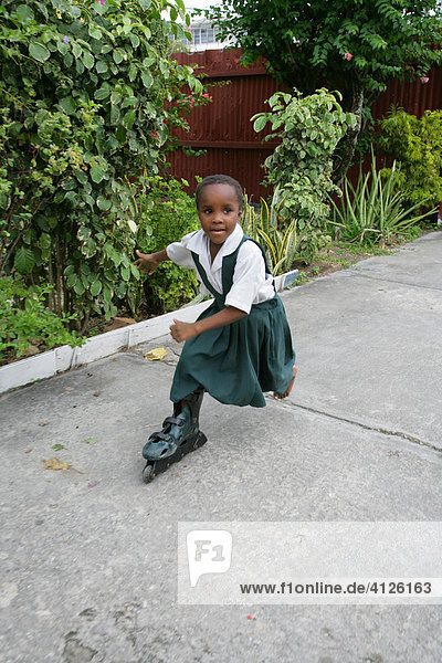 Girl wearing single inline skate at an Ursuline convent and orphanage in Georgetown  Guyana  South America