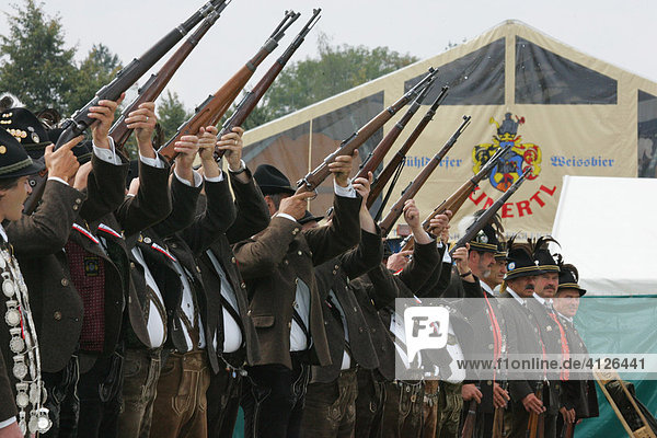 Riflemen firing a gun salute during a folk festival in Muehldorf am Inn  Upper Bavaria  Bavaria  Germany  Europe