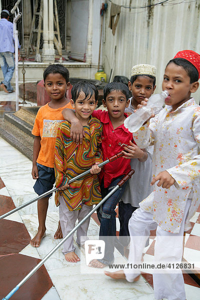 Children cleaning a Sufi shrine  Bareilly  Uttar Pradesh  India  Asia