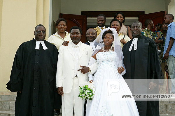 Bride and groom  wedding couple leaving church with pastors  Douala  Cameroon  Africa