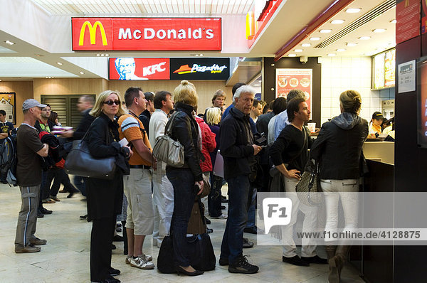 Departure hall  people standing in a queue in front of McDonalds  buying food before departure  Palma de Majorca  Balearic Islands  Spain  Europe