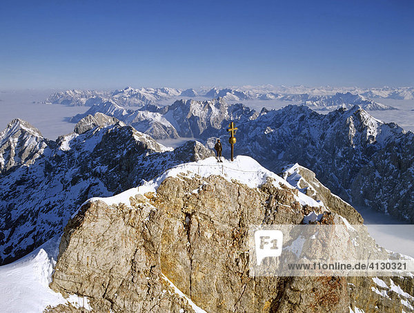 Panoramic view of the summit cross on Mt. Zugspitze  Wetterstein Range  Upper Bavaria  Bavaria  Germany  Europe