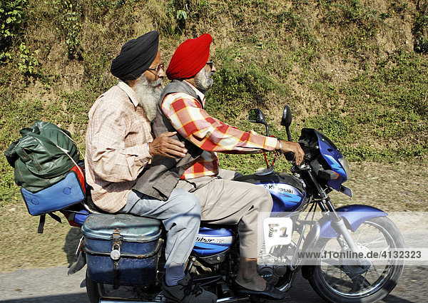 2 Men  sikhs  on a motor scooter on the road between Jammu and Palampur  Himachal Pradesh  India