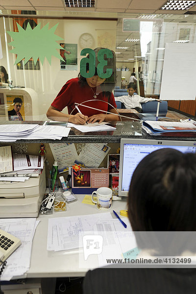 Customer Le Thi Binh in the credit department of the Vietcombank Hanoi Vietnam Asia