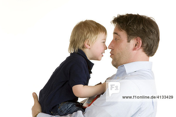 Father holding his two-year old son playing