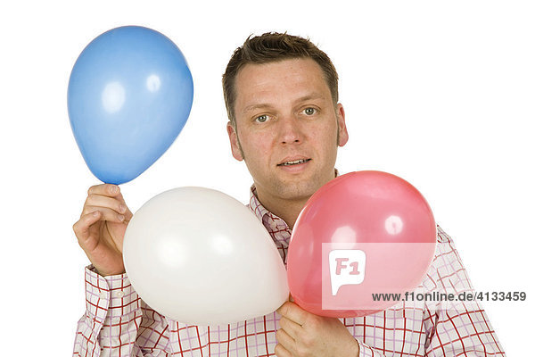 40-year-old man holding balloons
