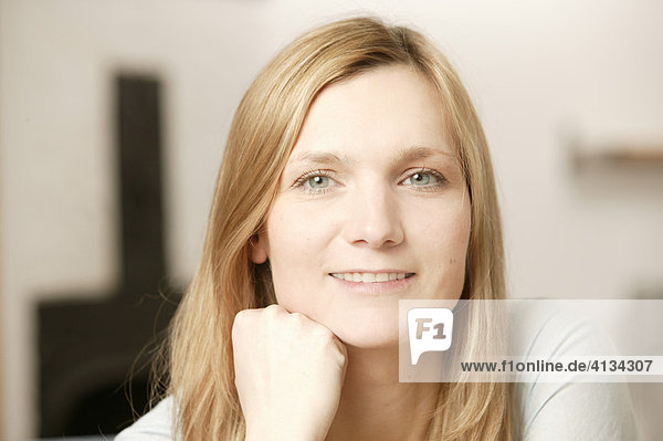 Young blonde woman smiling