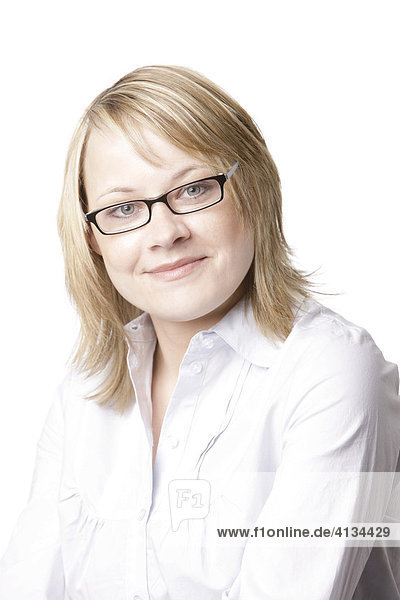 Blonde woman wearing a light-coloured blouse and glasses