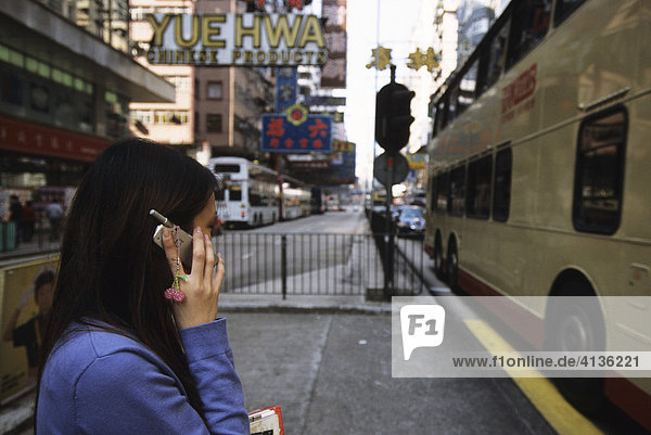 Young woman with mobile phone  Kowloon  Hong Kong  China