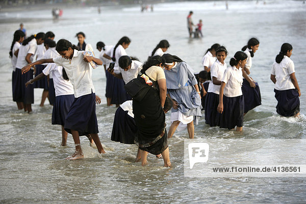 IND  India  Kerala  Trivandrum : Lighthouse Beach  Kovalam Beaches. Female students on a class trip at the beach. |
