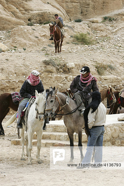 Horse riding  guides waiting for tourists  Petra  Jordan
