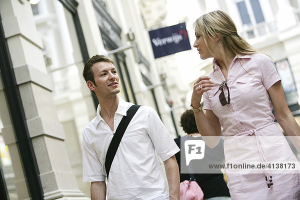 NLD Netherlands The Hague: Young couple window shopping in De Passage Mall. |