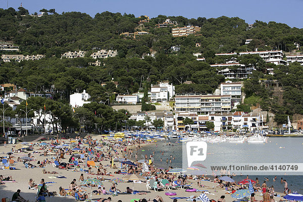 Crowded beach at Llafranc  coastal town on the Costa Blanca  Catalonia  Spain