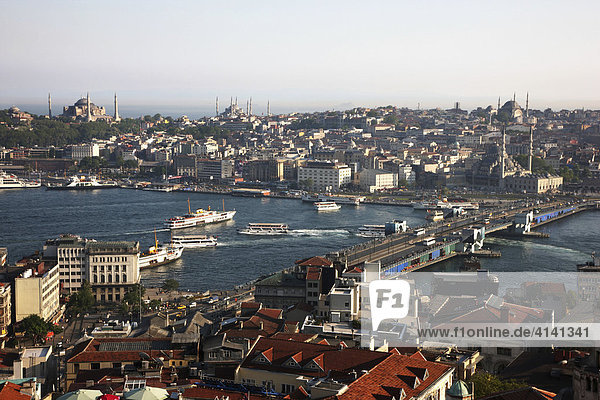 View over the Eminoenue district  with the Galata Bridge spanning the Golden Horn  with mosques in the distance  Istanbul  Turkey