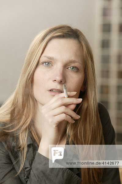 Smoking blonde woman