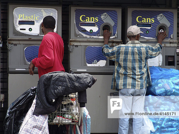 USA  United States of America  New York City: Harlem  125th Street  Refund mashines for cans and bottles  collected by people.