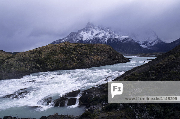 CHL  Chile  Patagonia: Torres del Paine National Park. Water fall with Mount Paine in the background.