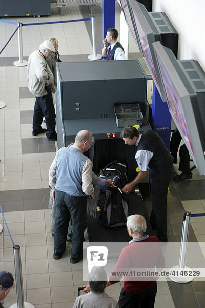 DEU  Germany  Berlin : Airport Berlin-Schoenefeld. Security controll. X-ray screening of baggage befor check in.