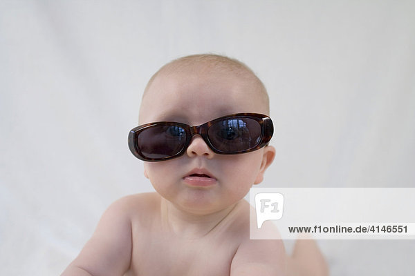 Baby wearing sun glasses